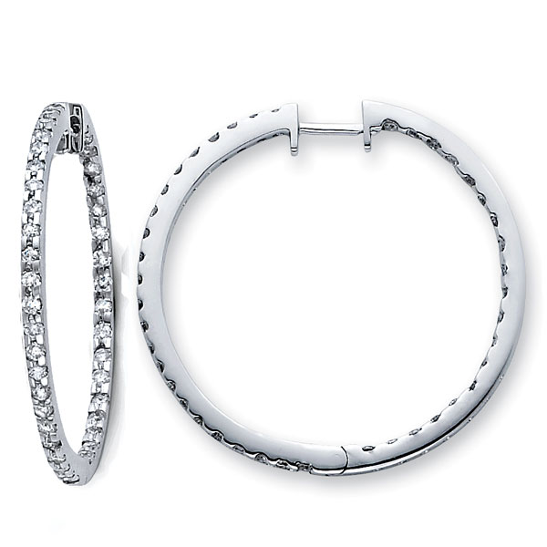 .  14K Diamond Hoop Earrings .71ctw The innovative diamond design in white gold makes our 14K Diamond Hoop Earrings an instant hit. Perfect for the contemporary female who appreciates elegance and who wants her jewelry to complement her own personal style.  Order this today or browse our incredible selection of fine diamond jewelry. Earring Information 14K White Gold 3.30 grams 20mm (just under 13/16 inch) Huggie back backing SI Clarity  G-H Color