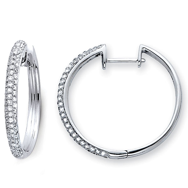 .  14K Small Diamond Hoop Earrings .71ctw The innovative diamond design in white gold makes our 14K Small Diamond Hoop Earrings an instant hit. Perfect for the contemporary female who appreciates elegance and who wants her jewelry to complement her own personal style.  Order this today or browse our incredible selection of fine diamond jewelry. Earring Information 14K White Gold 3.30 grams 18mm (just under3/4 inch) Huggie back backing SI Clarity  G-H Color